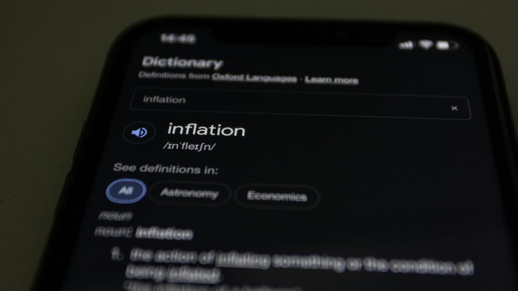 inflation word on smartphone touchscreen