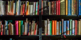 books in black wooden book shelf