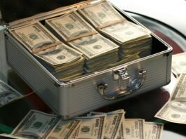 hard cash on a briefcase