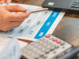 a close up shot of an agent pointing rates with a ballpen