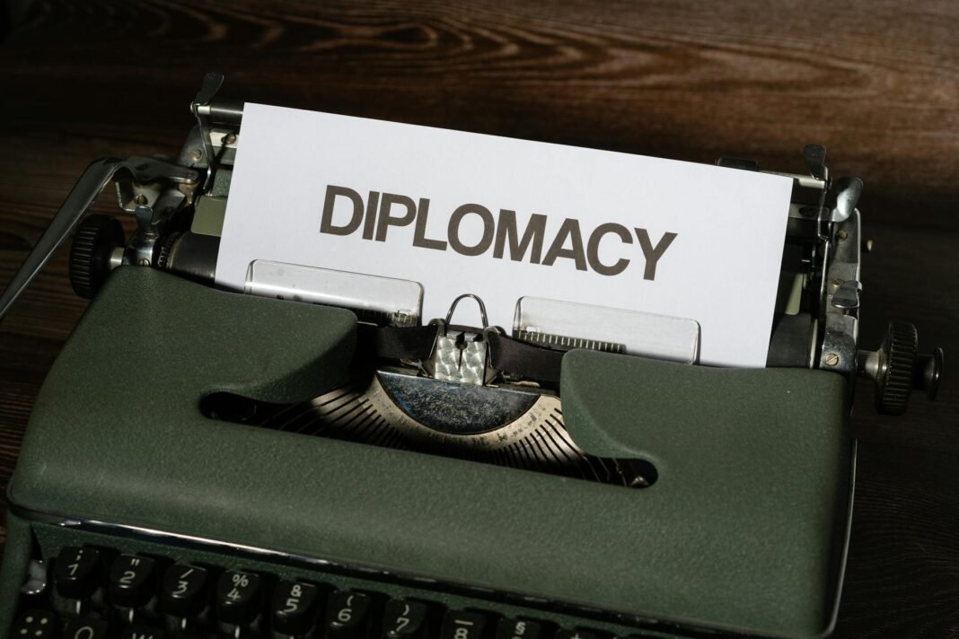 a white bond paper with diplomacy text on a typewriter