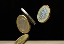 coins on brown wood