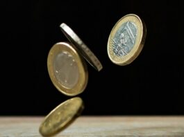 coins on brown wood