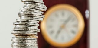 selective focus photo of stacked coins