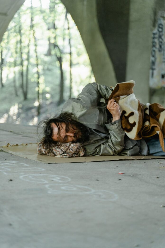 a homeless man sleeping