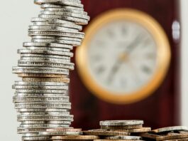 selective focus photo of stacked coins